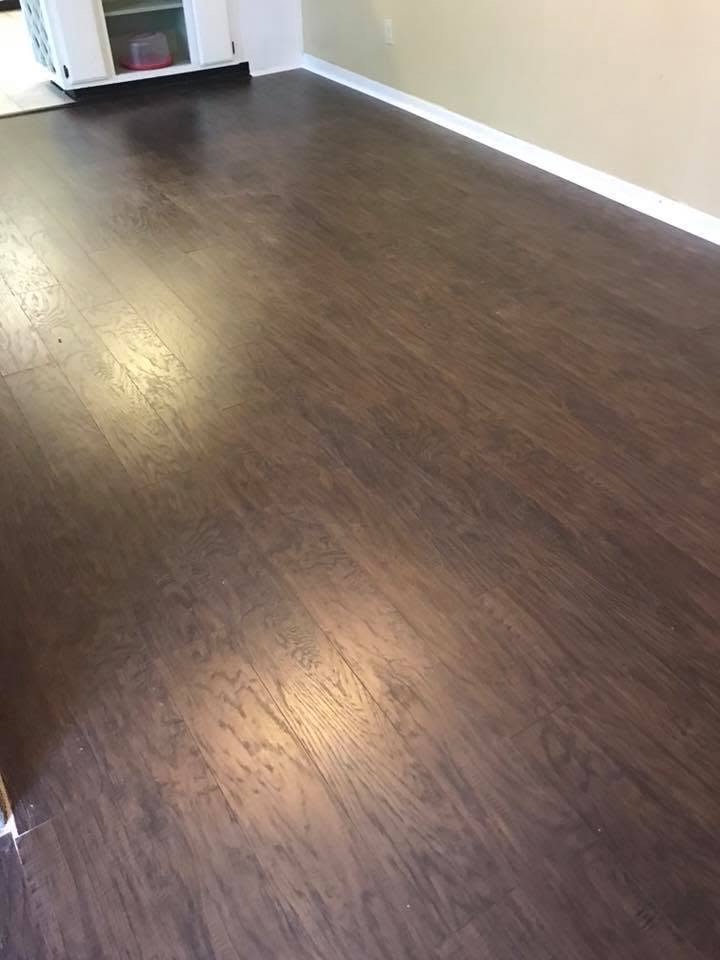 Finished dark wood-look flooring in a dining area